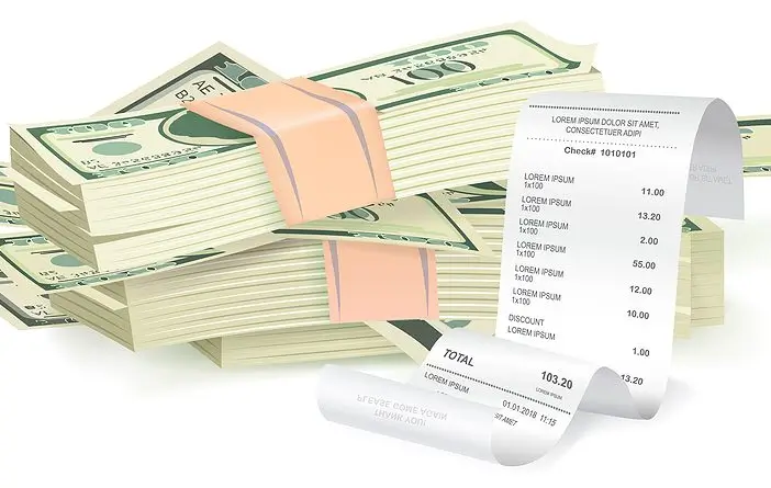bigstock-Payment-Check-Near-A-Stack-Of