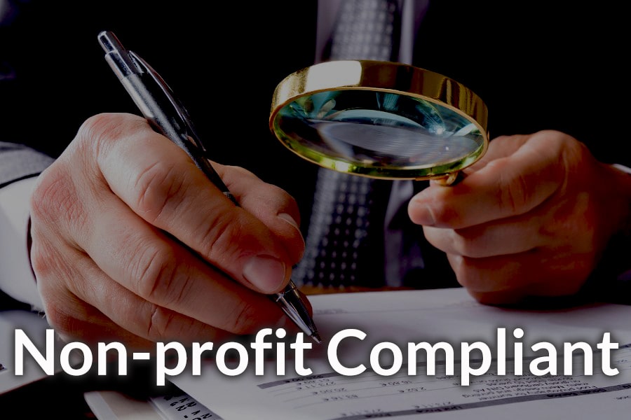 A man holding a magnifying glass illustrating accounting compliance. A man holding a magnifying glass illustrating accounting compliance.